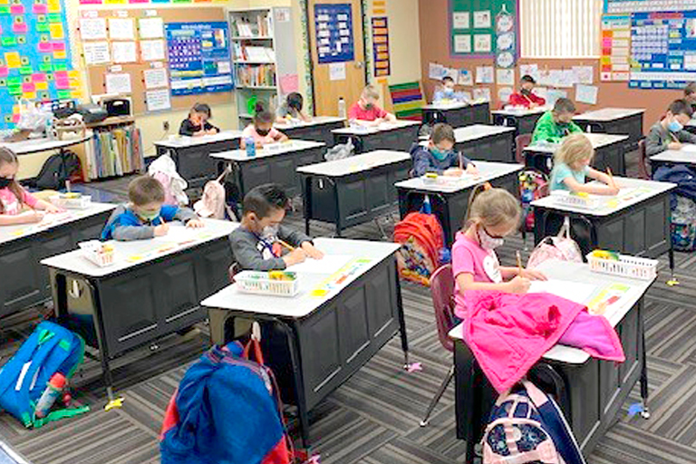 Classroom full of students working on math