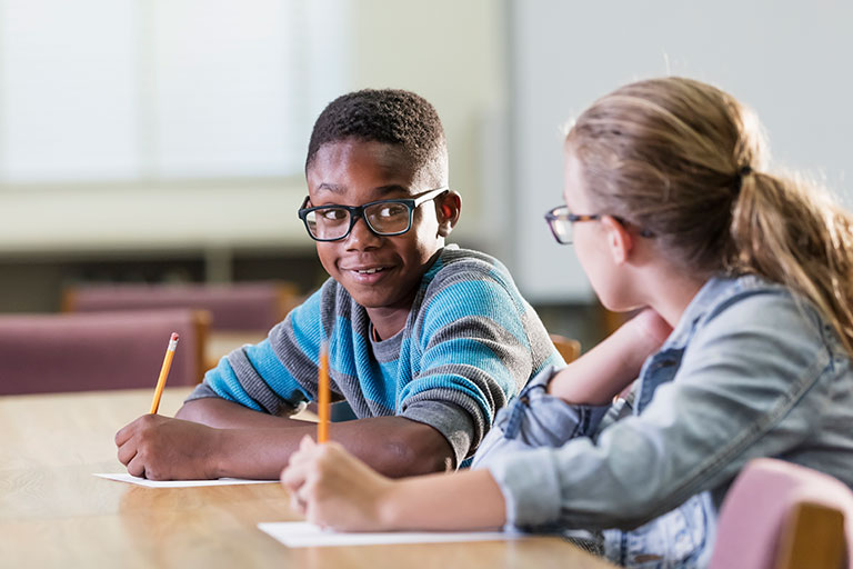 Two students working peer-to-peer on math problems