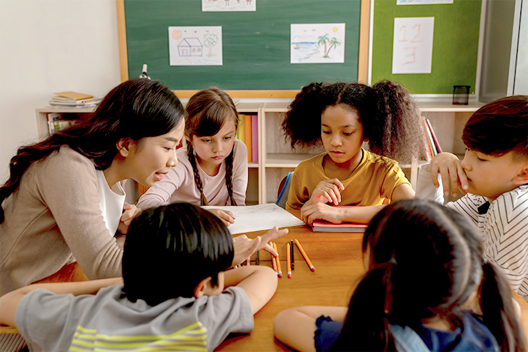 Teacher counting with diverse students doing math