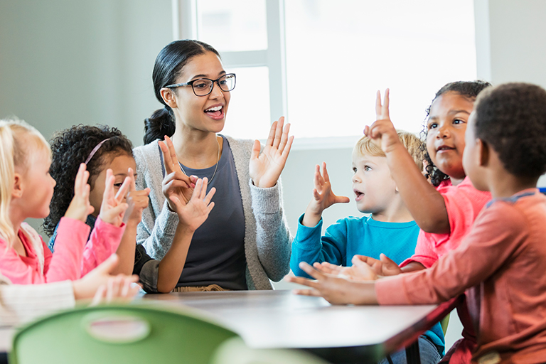 Teacher counting and singing with students