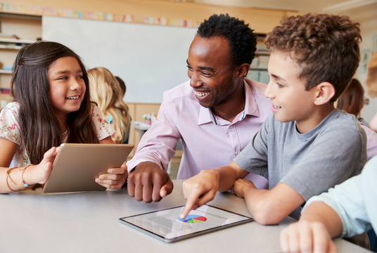 Teacher working with students