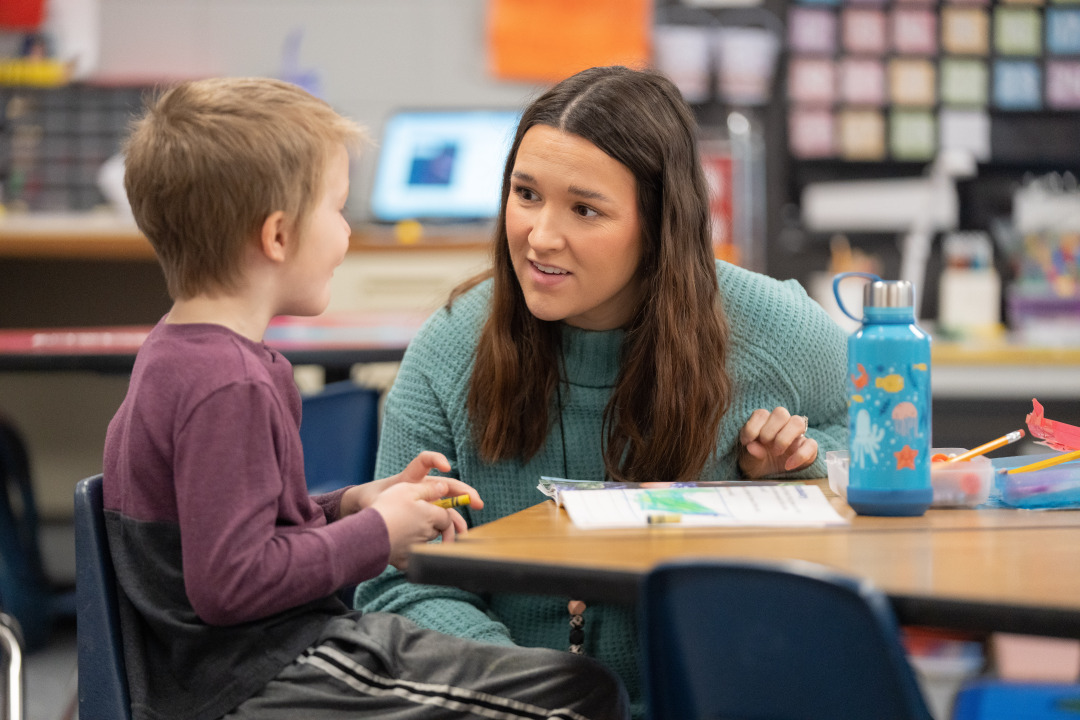 Teacher working with students