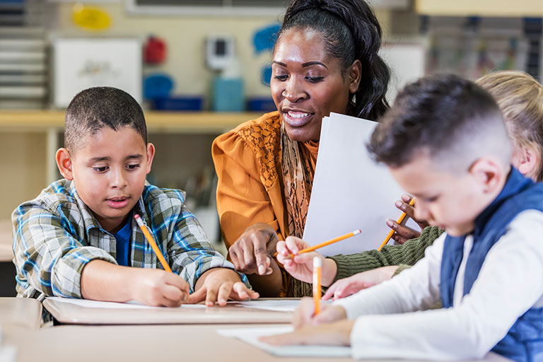 Teacher working with students